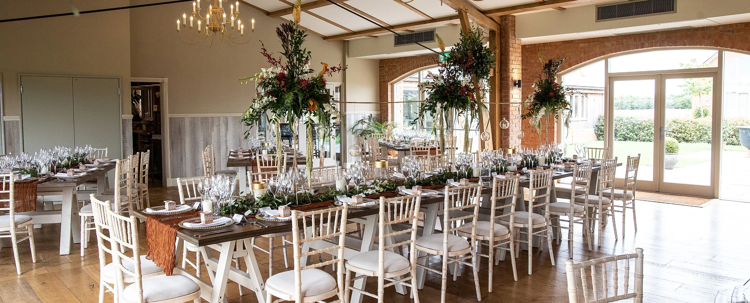 Wedding top table dressed with autumnal flowers